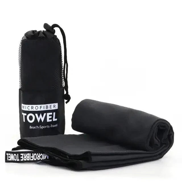 Mandotos Speedy Absorb Microfiber Towel spread out, showcasing its lightweight, quick-drying fabric for travel or sports use.