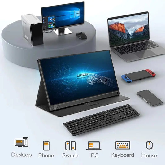 ZEUS 16'' 2.5K Ultra-Smooth Portable Gaming Monitor on a desk with keyboard, laptop, Switch, and smartphone.