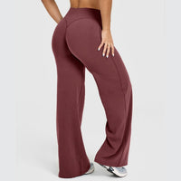 Women's straight-leg yoga pants by Ancient Energy in burgundy stretch fabric.