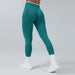 Seamless knitted high-waist teal sports yoga pants by Ancient Energy; quick-drying athletic leggings.