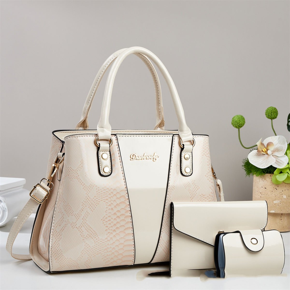 Shouldercrossbody bag with cream snakeskin pattern; Ancient Energy, gold hardware, includes matching wallet.