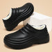 Insulated chef shoes, black closed-toe cotton slip-ons with white fleece lining for men; pair shown
