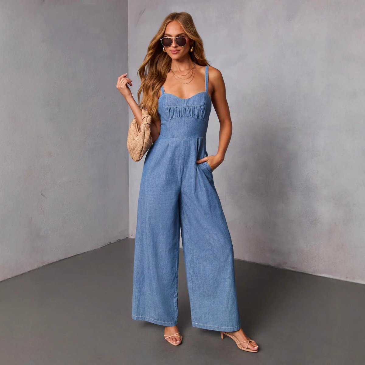 Denim jumpsuit for women with thin straps and wide-leg pants, light blue, pockets