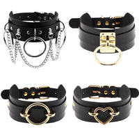 Set of four black leather chokers with gold-tone and silver-tone hardware, rings and a heart charm