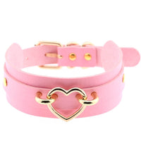 Pink double-wrap faux leather choker with gold heart ring centerpiece
