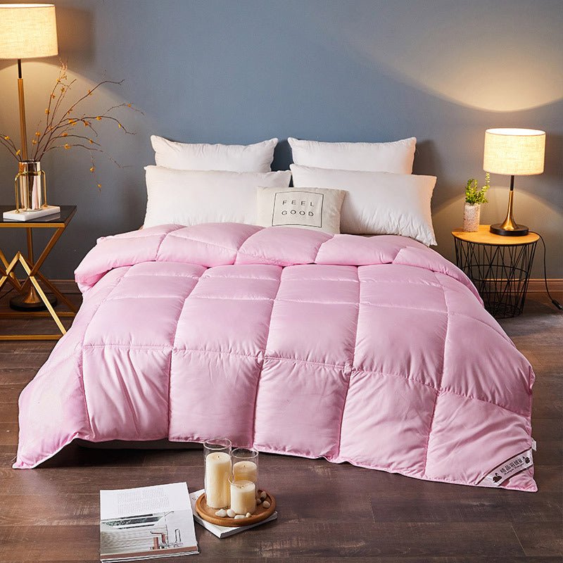 Down Duvet, pink color, draped over a bed with white pillows in a cozy bedroom.