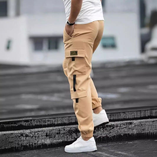 Men's retro jogger cargo pants in tan beige by Ancient Energy with side cargo pockets