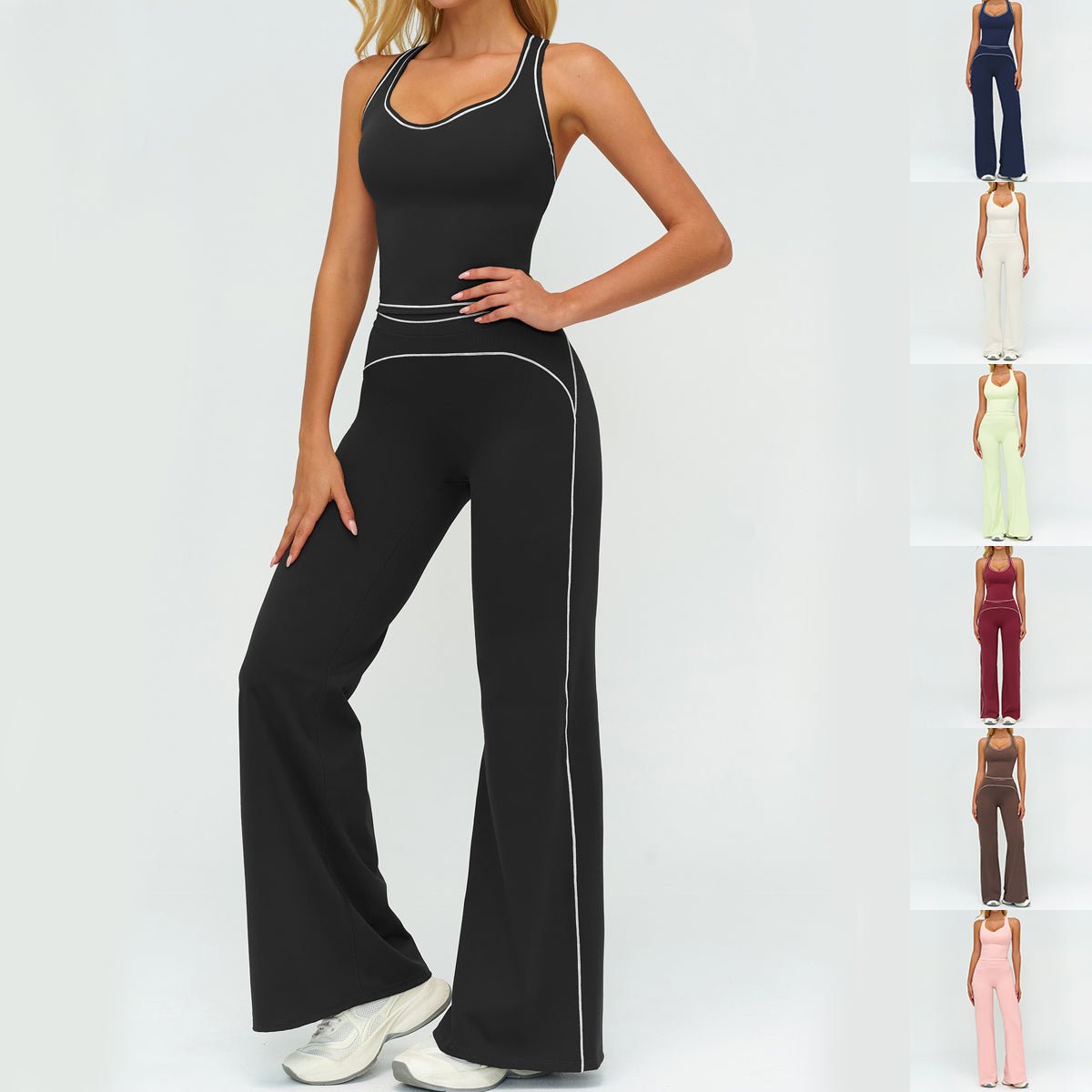 Womens yoga set with black sleeveless V-neck top and matching slim straight pants with white piping.