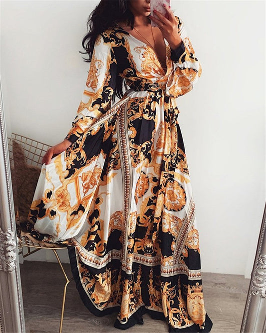 Mandotos International vintage floral evening dress with V-neck, featuring elegant floral pattern and flowing fabric.