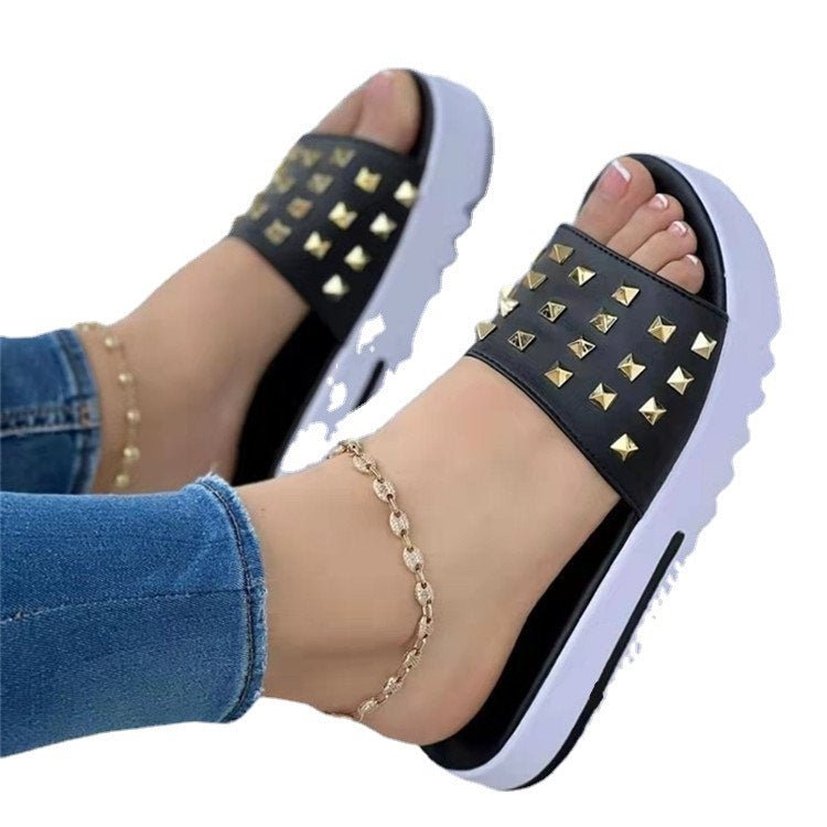 Women's wedge flip-flops with gold rivet studs, black strap and white sole by Ancient Energy