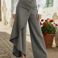 Ancient Energy gray faux-denim straight-leg pants with a front row of large buttons and an asymmetric wrap hem.