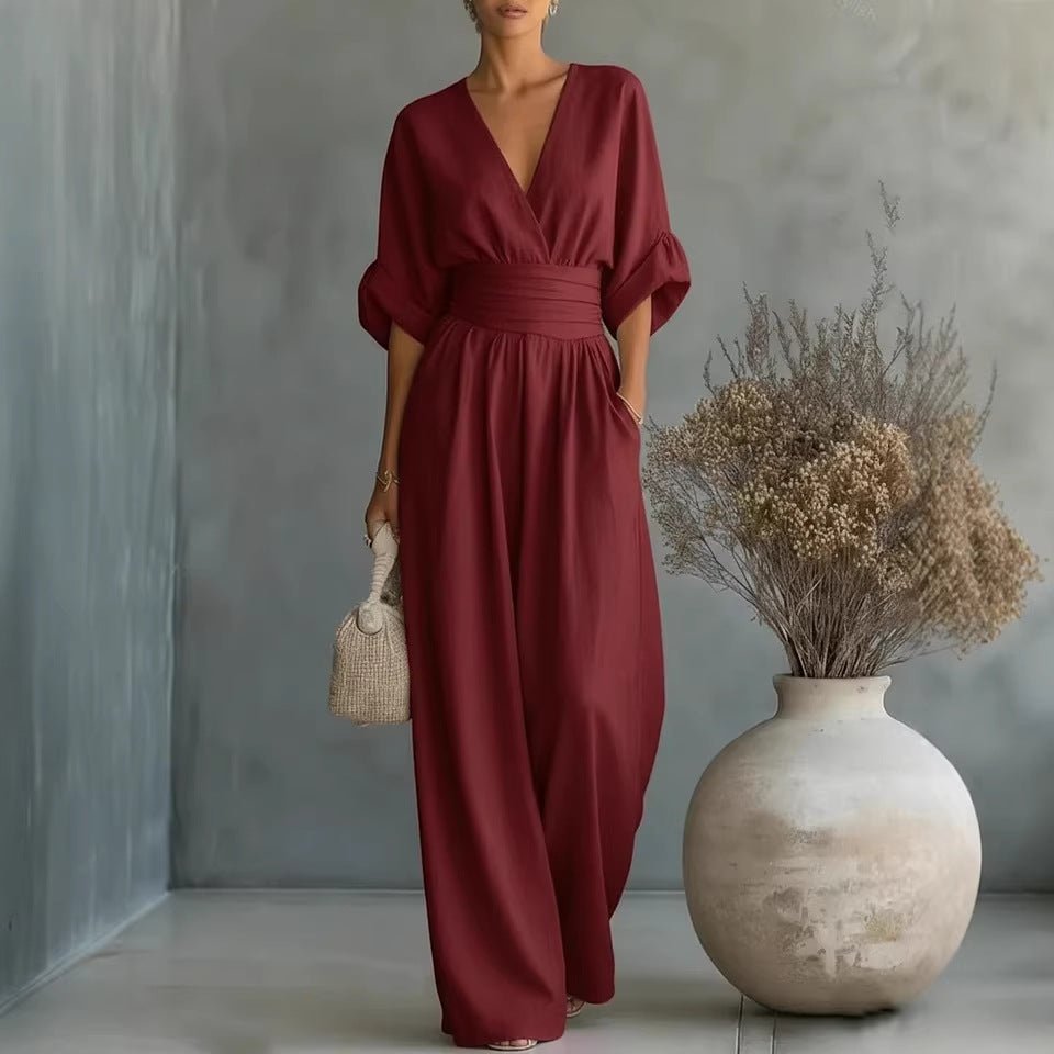 Women's burgundy short-sleeved V-neck jumpsuit with wide-leg pants and wide waistband