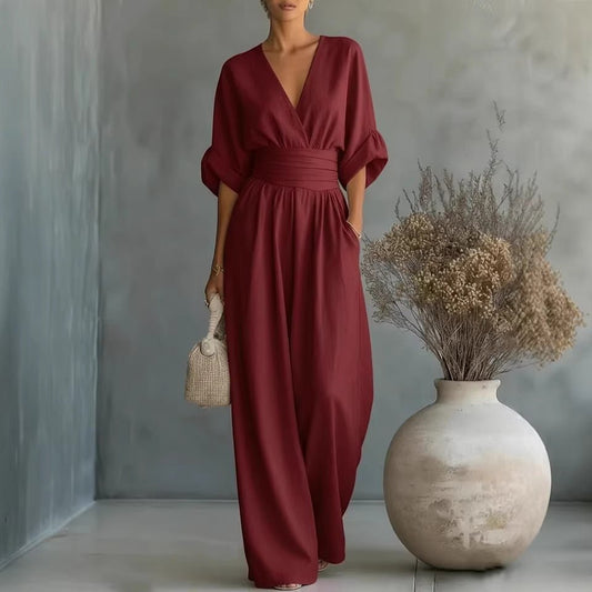 Women's burgundy short-sleeved V-neck jumpsuit with wide-leg pants and wide waistband