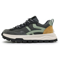 Casual dad sneaker with gray suede toe, black mesh, olive-green side overlays, tan heel, and chunky sole