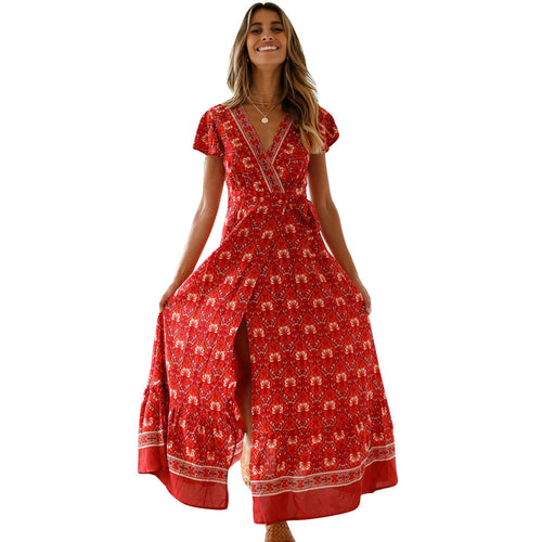 Mandotos International Tropical Bloom Maxi Dress featuring vibrant floral patterns and flowing fabric, perfect for summer occasions.