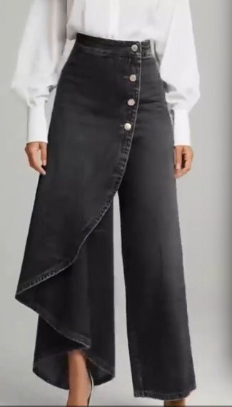 Unique straight-leg pants by Ancient Energy in black faux denim with asymmetric wrap hem and front button row.