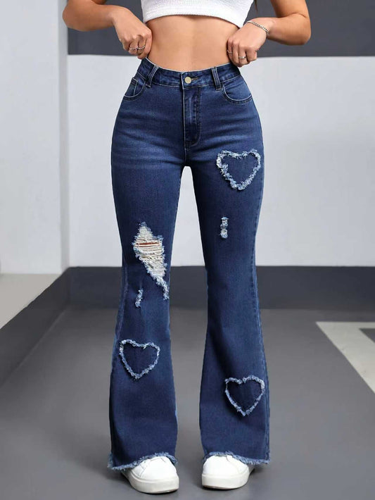 Denim jeans for women with distressed patches and heart-shaped frayed patches on both legs, dark wash bootcut.