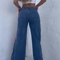 Leopard print zip-up jeans in blue denim, wide-leg fit with back pockets