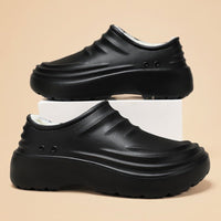 Insulated chef shoes, black closed-toe slip-ons with plush lining and thick sole, pair