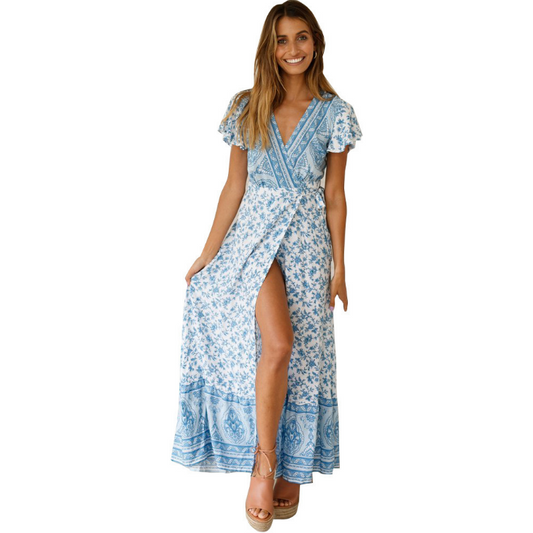 Mandotos International Tropical Bloom Maxi Dress featuring vibrant floral patterns and flowing fabric.