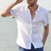 Men's white short-sleeve button-up shirt by Ancient Energy, casual summer top