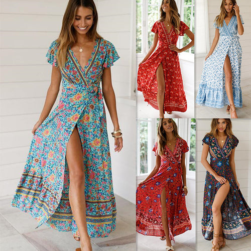 Mandotos International Tropical Bloom Maxi Dress with vibrant floral pattern, flowing fabric, and sleeveless design.