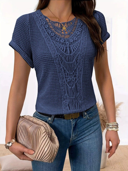 Ancient Energy blue hollow-out short-sleeve lace top with intricate neckline, paired with jeans