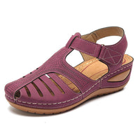 Women's plus-size retro wedge sandal with purple cutout upper, round toe, ankle strap