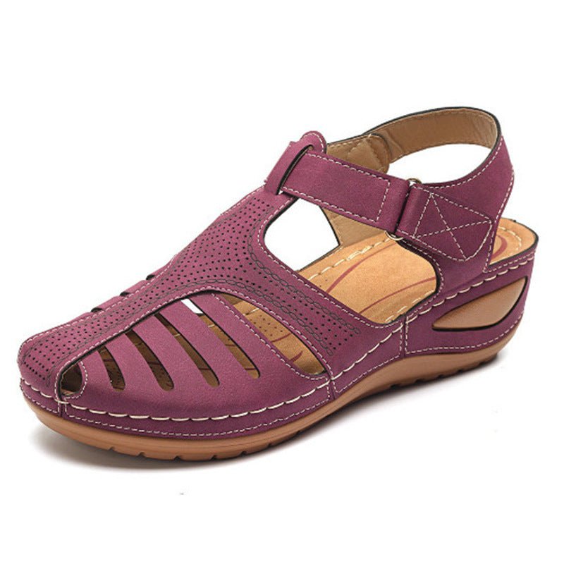 Women's plus-size retro wedge sandal with purple cutout upper, round toe, ankle strap