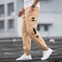 Men's beige Ancient Energy retro jogger casual work pants with cargo pocket, flap, black strap and elastic cuffs.