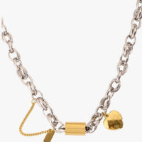 Versatile Titanium Bracelet with Heart Pendant by Ancient Energy; silver chain with gold heart charm.