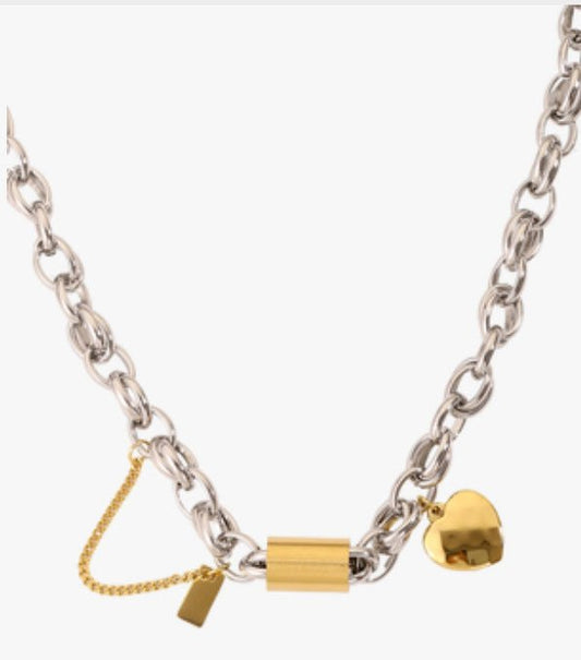 Versatile Titanium Bracelet with Heart Pendant by Ancient Energy; silver chain with gold heart charm.
