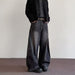 Mens wide-leg denim pants from Ancient Energy, dark wash with distressed detailing.