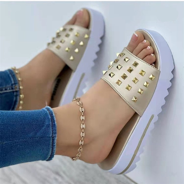 Women's wedge rivet beach flip-flops in beige with gold studs and chunky white sole