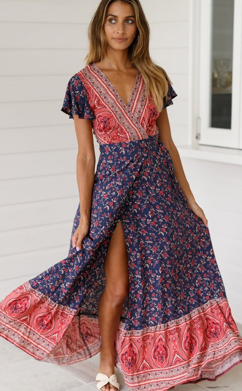 Mandotos International Tropical Bloom Maxi Dress with vibrant floral pattern and flowing fabric for a stylish summer look.