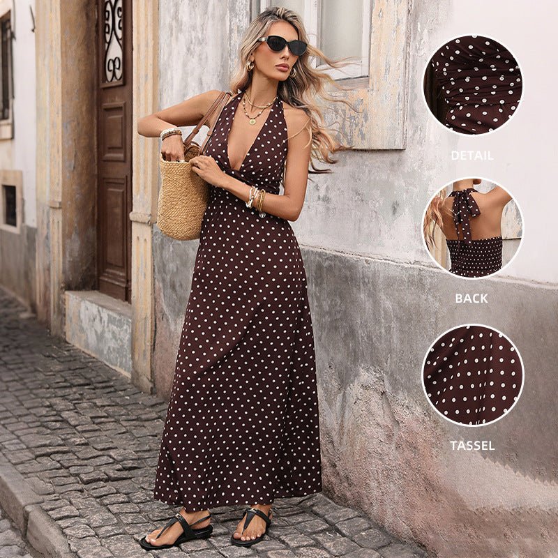 Polka-dot halter-neck long dress in brown with a V-neck, worn by a woman on a street
