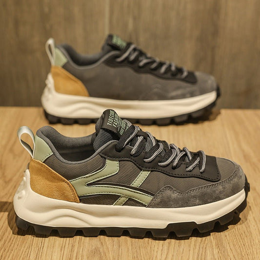 Casual dad sneakers with olive-green accents, gray upper, tan suede heel, and chunky white midsole