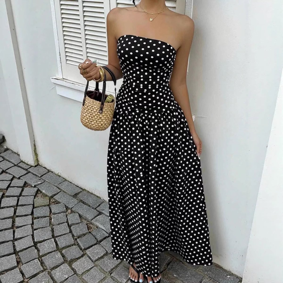 Polka-dot strapless off-shoulder maxi dress by Ancient Energy, black with white dots, ruched waist