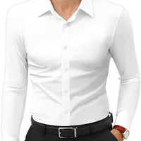 Mens slim-fit white long-sleeve solid-color work shirt tucked into black dress pants with a black belt.