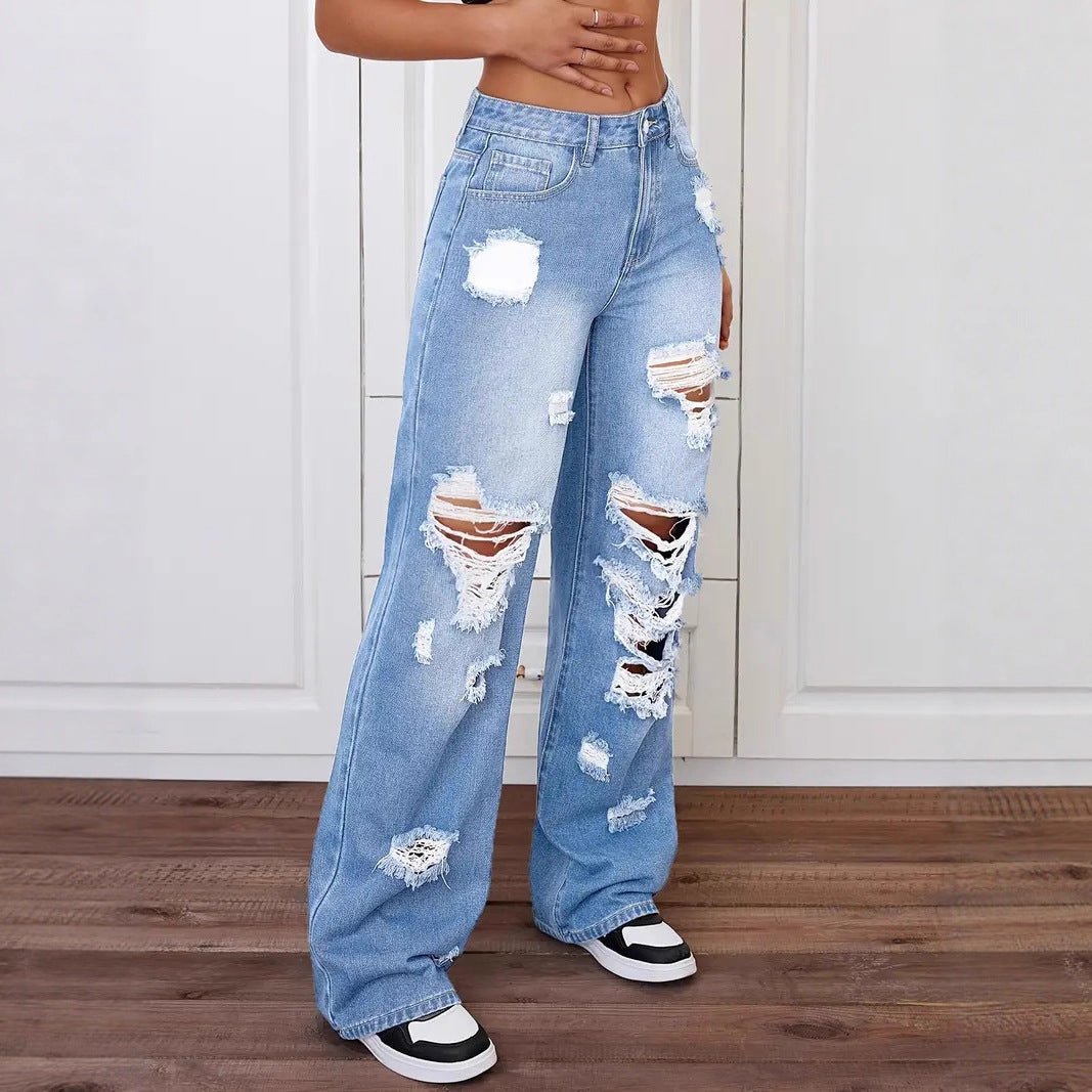 Trendy washed ripped straight jeans for women in light blue denim, distressed by Ancient Energy