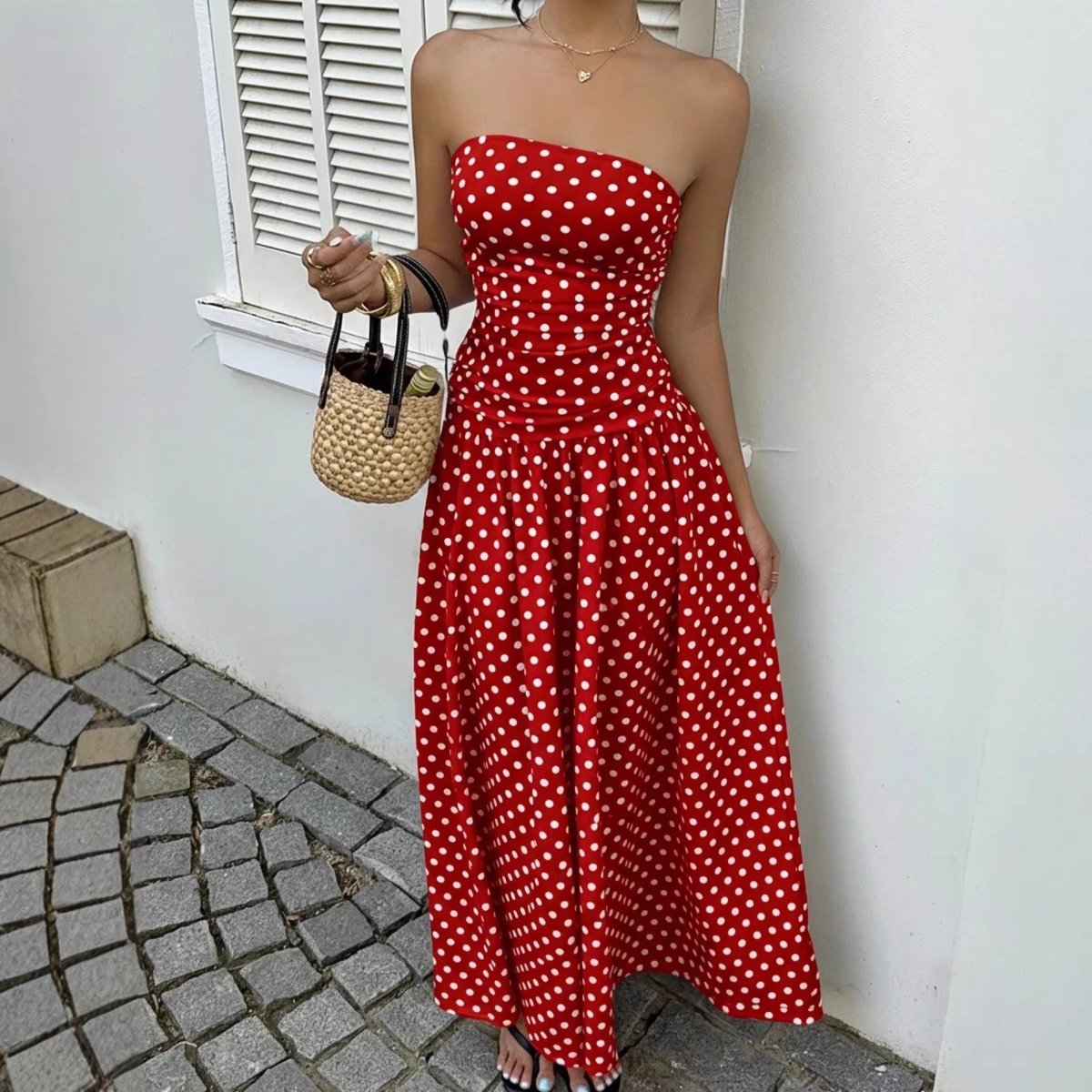 Dress: red polka-dot strapless maxi by Ancient Energy, high-waist; with straw handbag
