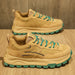 Ancient Energy casual dad shoes; tan suede sneakers with teal laces and teal outsole, pair