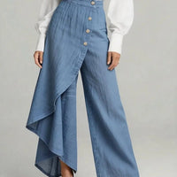 Women’s light-blue faux denim straight-leg pants with an asymmetrical wrap panel and large front buttons