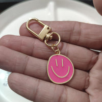 Cross-border e-commerce alloy color dripping smiley face keychain electroplated gold irregular expression bag pendant accessories