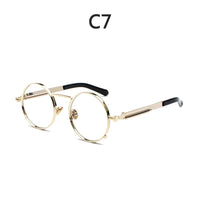 Gold-tone round metal glasses with adjustable nose pads, black temple tips, vintage steampunk style.