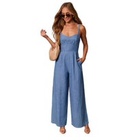 Solid-color casual workwear jumpsuit for women in blue denim, with spaghetti straps and pockets