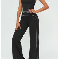 Womens yoga set 2-piece: black sleeveless V-neck top with white piping and matching slim straight pants