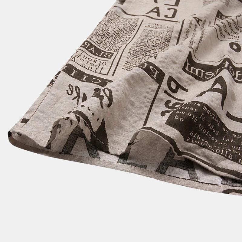 3XL men's vintage Hawaiian shirt with newspaper print by Ancient Energy, featuring bold, colorful tropical design and short sleeves.