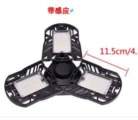 Ancient Energy 60W super bright deformable LED light illuminating gym, warehouse, or garage with 6000 lumens brightness.
