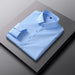 Mens Slim-Fit Solid-Color Work Shirt in light blue by Ancient Energy, neatly folded
